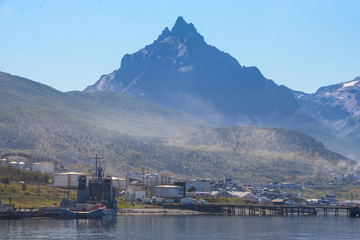 Fototapeta na wymiar Ushuaia, City at the End of the World, Argentina. This is place is full of mountains and rivers and snow around the city center, and the city center is a little town, look like more a village than a c