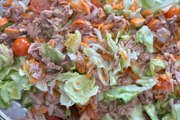 tuna salad with carrot tomato and lettuce