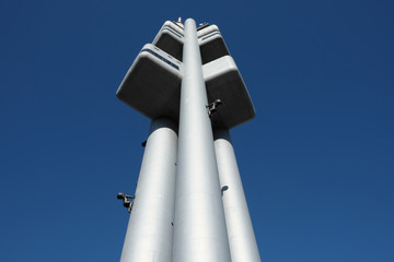 Zizkov television tower against the blue sky. View from below.