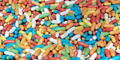 Fototapeta na wymiar A pile of colorful sweets as a background. Candy close-up.