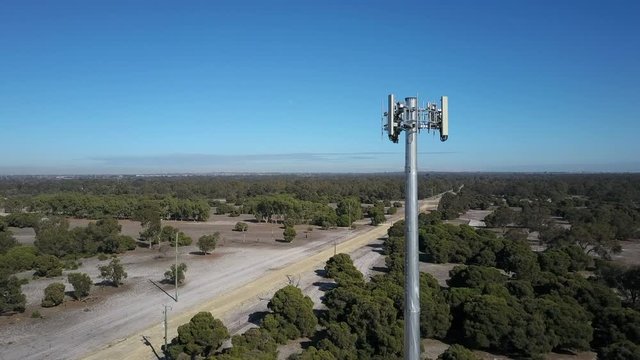 Aerial View Of Telecom Satellite Antenna Towers For Wireless Mobile Data Transmission, With Blue Sky, Rural Landscape And Horizon.