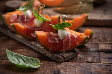 Fresh water melon with parma ham, basil and cherry mozzarella