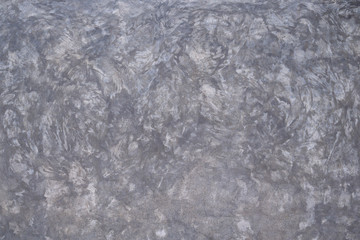 Close-up of the bare cement wall. Gray cement texture backdrop.