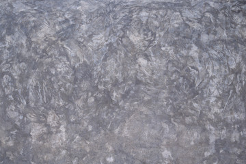Fototapeta premium Close-up of the bare cement wall. Gray cement texture backdrop.