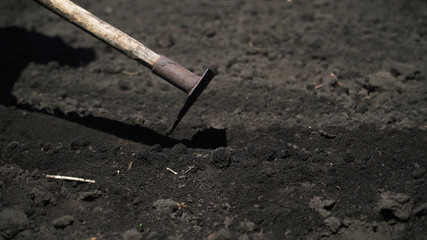 Land cultivation with hand tools