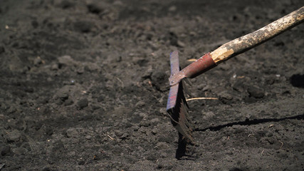 Land cultivation with hand tools