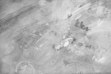 Monochrome texture of dirty magnetic board.