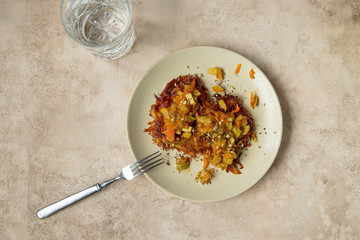 home healthy breakfast: hash brown with veggies and mineral water 