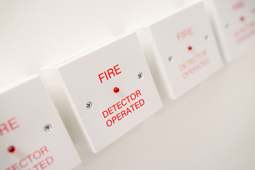 Fire detectors on white wall. Fire safety concept.