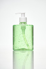 Isolated green hand sanitizer bottle with dosifyer