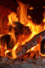 Fototapeta premium Sparks from fire in fireplace with bokeh balls.