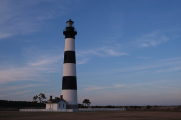Bodie Island historic Lighthouse in the Cape Hatteras National Seashore at sunset, Outer Banks,...