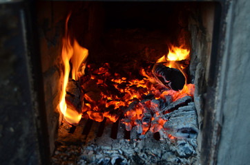 Sparks from fire in fireplace with bokeh balls.