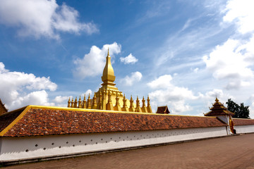 Naklejka premium Phra That Luang .The Golden Pagoda place of travel landmark and Famous in vien tien Laos on a clear day