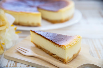 New York cheesecake on white wooden table - homemade cooking bakery concept