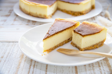 New York cheesecake on white wooden table - homemade cooking bakery concept