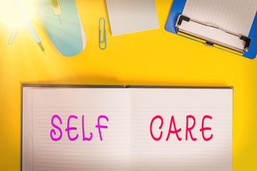 Writing note showing Self Care. Business concept for the practice of taking action to improve one s...