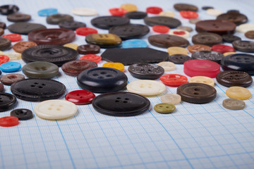 Obraz na płótnie Canvas Colorful mixed sewing buttons on black background, flat lay. Top view.