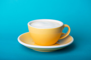yellow cup on a blue background