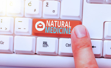 Conceptual hand writing showing Natural Medicine. Concept meaning any of various systems of healing...