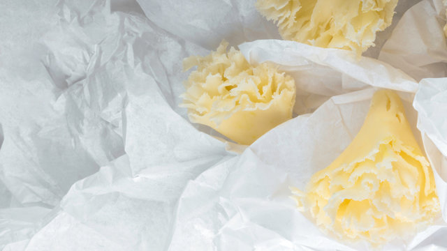 Swiss cheese Tete de Moine in paper