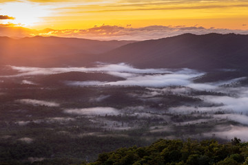 Fototapeta na wymiar Scenic sunrise view of the Blue Ridge Mountains near Asheville, North Carolina from the Blue Ridge Parkway, a scenic byway stretching across the mountains of western NC.