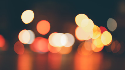 Abstract bokeh lights defocused on black background