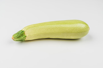 Ripe zucchini on a white background. One vegetable for the template