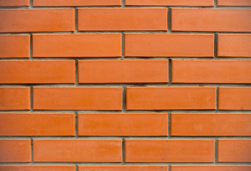 Obraz premium Orange bricks wall close up background. New built brick wall texture.