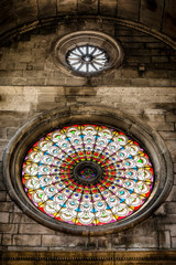 Gothic rosette, and stained glass, as a facade of St. Jacob Cathedral in Sibenik, Croatia.
