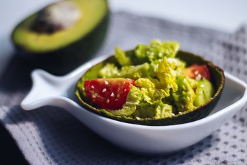 Avocado salad on a white plate