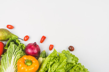 Vegetables and fruits on a white background are framed on the left