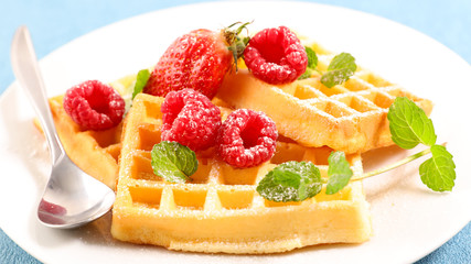 waffle with raspberry, mint leaf and sugar powder