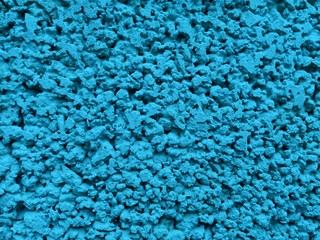Concrete blue aqua mint plaster stucco parget wall texture. Blue grunge wall plaster texture as background. Decorative blue aqua mint wall painted stucco. Rough aqua mint grain plaster stucco texture