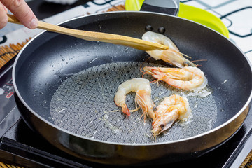 cooking grilled shrimps in pan