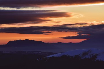 colorfully clouds at sunset in top of the mountain on winter time at high altitudes