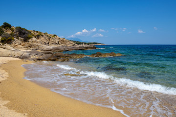 Beautiful seascape with beach, rocks and clear transparent water. Sithonia, Halkidiki, Greece.