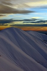 Fototapeta na wymiar colorfully clouds at sunset in top of the mountain on winter time at high altitudes