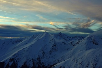 colorfully clouds at sunset in top of the mountain on winter time at high altitudes