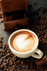 Latte art on a tide of coffee beans