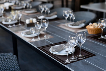 Festive table setting with empty wine glasses