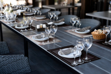 Festive table setting with empty wine glasses