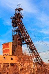 Fototapeta na wymiar Old rusty mine headgear in Kryvyi Rih, Ukraine