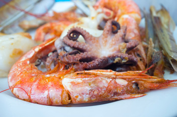 Assorted grilled seafood on plate