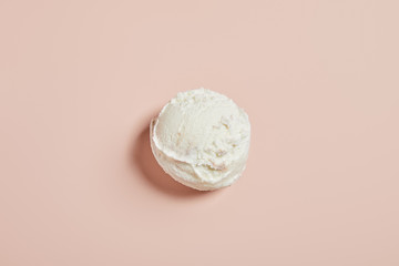 top view of fresh tasty ice cream ball on pink background