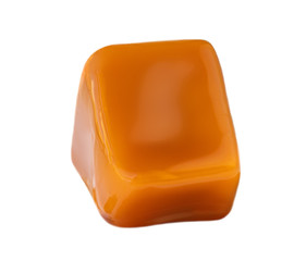 Caramel chunk  isolated on white background. Golden Butterscotch toffee candy.