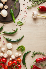 top view of fresh ripe vegetables, herbs, spices and mushrooms on wooden table