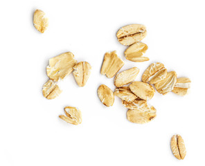 Oat flakes isolated on white background. Pile of oatmeal  top view.