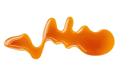 Flowing Caramel sauce isolated on white background. Golden Butterscotch toffee candy.