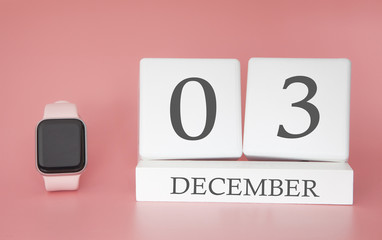 Modern Watch with cube calendar and date 03 december on pink background. Concept winter time vacation.